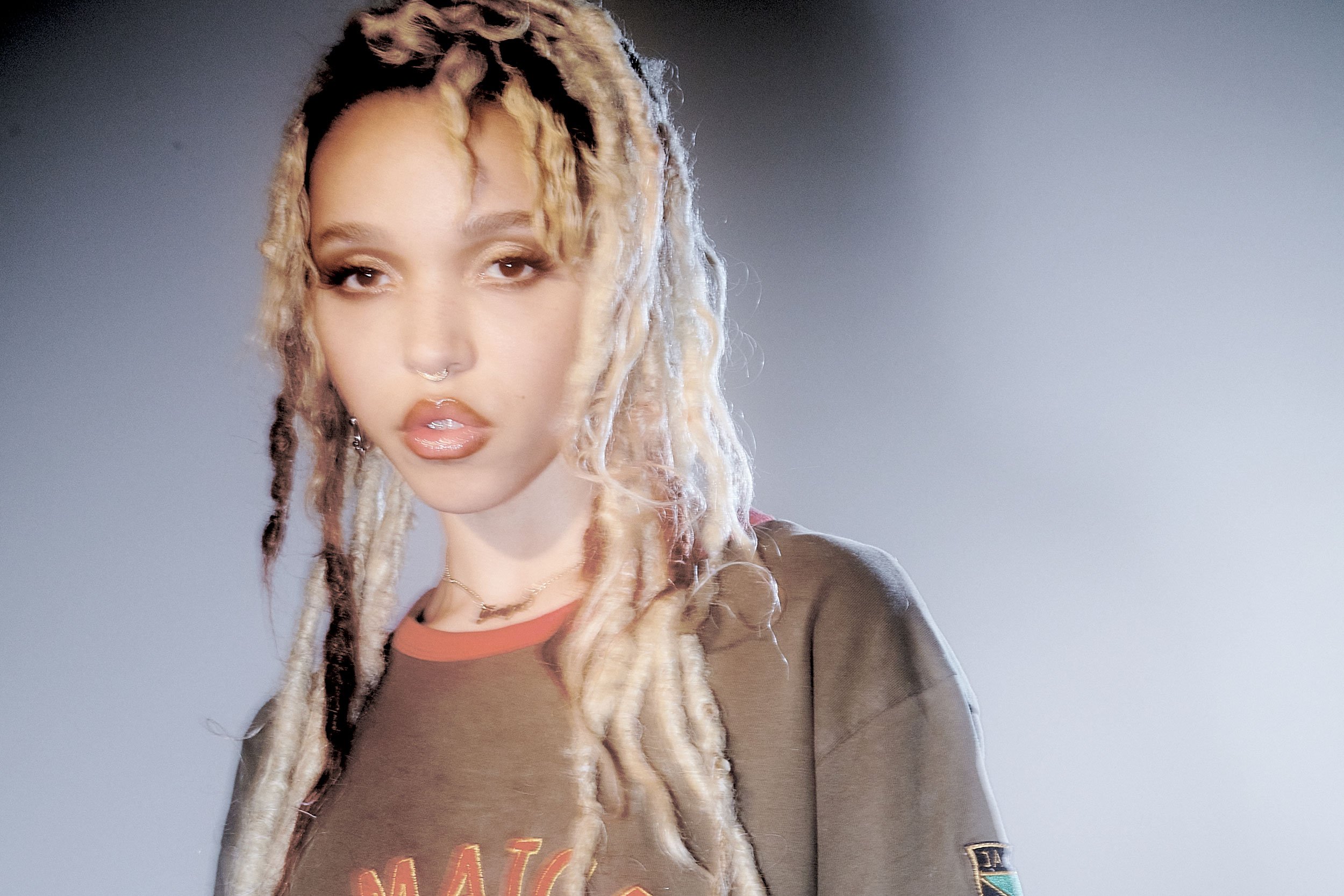 FKA Twigs posing for an expressive portrait